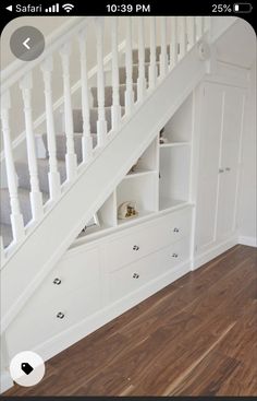 a white staircase with drawers underneath it