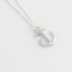 Anchor Necklace for women This anchor necklace is a symbol of hope and safety, making it a great gift for those who go out to sea. The stainless steel chain is sturdy, and Cover yourself in the light of the moon with the Anchor Necklace. Reminiscent of a starry night at sea, the Anchor Necklace for women features a large, authentic anchor pendant, crafted from silver and accented with white crystals. Pair this piece with your favorite dress and some silver flats for a classic look that is perfec Everyday Silver Jewelry With Anchor Shape, Everyday Silver Anchor Jewelry, Everyday Nautical Anchor Jewelry, Silver Anchor Necklace Nautical Style, Silver Anchor Jewelry With Lobster Clasp, Nautical Sterling Silver Anchor Necklace, Anchor Shaped Jewelry With Adjustable Chain For Gift, Silver Nautical Anchor Jewelry, Silver Anchor-shaped Nautical Jewelry