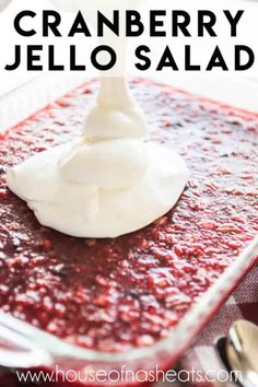 cranberry jello salad in a glass dish with whipped cream on top and text overlay