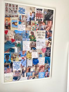 a white refrigerator freezer sitting next to a wall covered in pictures and magnets