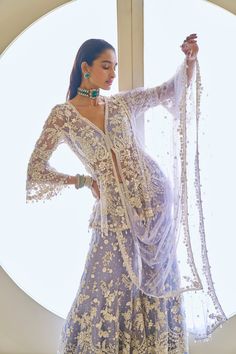 This sharara set features intricate pearls, sequins, and crystal embroidery. The mauve peplum top shows a plunging neckline with pearl and crystal detail. The heavily embroidered dupatta shows crystal tassels on all four sides.From Seema Gujral's Fiori collection. DELIVERY TIMEPlease allow 8-12 weeks for your outfit to arrive. FABRIC DETAILSNet Professional cleaning only. Indian Wedding Reception Outfits, Indian Fashion Trends, New Saree Blouse Designs, Crystal Embroidery, Fashion Courses, Traditional Indian Dress, Clueless Outfits, Fashion Top Outfits, Indian Dresses Traditional