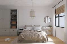 a bedroom with white walls and wooden floors