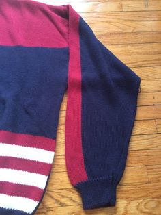 If you love the USA, this is the perfect sweater for your life. It is in amazing condition and is super soft and comfortable. It will be perfect for cold weather or just for a cooler spring night. There are no rips, holes or stains. Measurements: Pit to pit: 23 1/2 inches Collar to bottom front: 22 inches Collar to bottom back: 24 inches Sleeve Length (from collar): 29 1/2 inches Size on tag: no tag (measures like XL) Sporty Knitted Fall Sweater, 90s Style Cotton Sweater For Fall, Sporty Knitted Winter Sweater, Casual Red Polo Sweater For Winter, Casual Red Sweater For Cold Weather, Retro Knit Sweater With Ribbed Cuffs, Red 90s Style Winter Sweater, Cozy Red Sweater With Ribbed Cuffs, America Flag Sweater