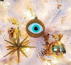 an eyeball ornament on a white christmas tree