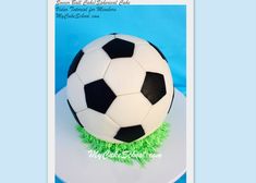 a soccer ball cake on top of a table