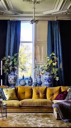 a living room filled with furniture and vases on top of it's windowsill