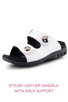 Stylish white leather sandals with arch support and decorative buttons. Adjustable Leather Slippers With Arch Support, White Leather Slippers With Cushioned Footbed, Comfortable White Leather Sandals, Comfortable Leather Open Toe Slides, Comfortable Leather Slides With Leather Footbed, Comfortable Leather Slides With Arch Support, Comfortable Slip-on Eva Sandals, White Leather Slide Sport Sandals, Adjustable White Leather Slides