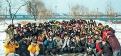 a group of people posing for a photo in the snow