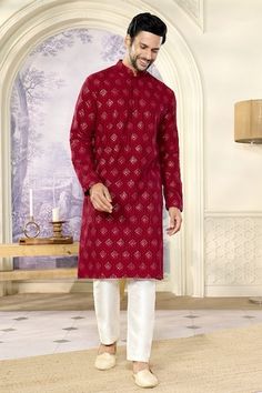 Reddish maroon full sleeves kurta crafted in silk with all over crescent bloom chikankari embroidery and sequin highlights. Paired with a pant. - Aza Fashions Red Straight Kurta With Naqshi, Red Sherwani With Chikankari Embroidery For Puja, Red Chikankari Embroidery Sherwani For Puja, Red Sherwani With Chikankari Embroidery Long Sleeve, Red Straight Kurta With Naqshi Detailing, Maroon Chikankari Kurta, Red Embroidered Shantoon Kurta, Wine Kurta For Men, Red Embroidered Slub Silk Kurta