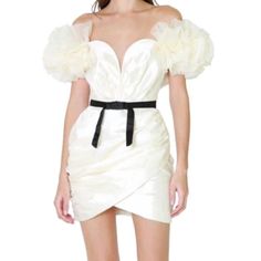 Features A Luxe Organza Fabrication, A Wire-Reinforced Plunge Neckline, Voluminous Ruffled Off Shoulder Detailing, Flattering Ruched Body Detailing, And A Bodycon Silhouette. Complete With An Attached Contrasting Bow Belt , A Smooth Inner Lining, A Removable Halter Neck Strap, And A Concealed Back Zipper Closure. Self - 100% Polyester; Contrast - 100% Polyester; Lining - 97% Polyester, 3% Spandex. Cocktail Puff Sleeve Mini Dress With Ruffles, Cocktail Mini Puff Sleeve Dress With Ruffles, Chic Off-shoulder Puff Sleeve Dress With Ruffles, Puff Sleeve Pleated Mini Dress For Brunch, Short Sleeve Pleated Puff Sleeve Dress For Party, Feminine Off-shoulder Puff Sleeve Party Dress, Pleated Puff Sleeve Dress For Party, Brunch Mini Dress With Puff Sleeves And Pleated Details, Chic Puff Sleeve Dress With Ruffles For Brunch