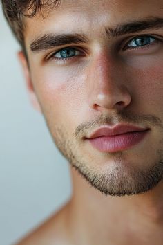 a close up of a man with blue eyes