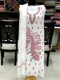 A stunningly marvelous outfit. This outfit features kashmiri sozni (needle) hand embroidery on the neckline with all over booties and on sleeves. The Dupatta features two sided embroidered border with all-over booties.- - - - - - - - - - - - - - - - - - - - Product DetailsCondition: Brand NewF A B R I CShirt: Jacquard GeorgetteDupatta: ChiffonLower: Indian CrepeUnstitchedColor: WhiteCare Instructions: Dry Clean Only✿Subscribe to our Newsletter to get a 20% Discount/Coupon Code in your email Inbo Unstitched Straight Kurta With Multicolor Embroidery, Unstitched Straight Kurta Dress With Multicolor Embroidery, Semi-stitched Multicolor Cambric Dress, Traditional White Dress With Dabka Work, White Traditional Embroidered Dress With Zari Work, Traditional White Embroidered Dress With Zari Work, Designer Multicolor Cambric Dress, White Embroidered Bollywood Dress, Fitted Cambric Lawn Suit With Embroidery