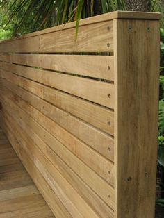 a wooden bench sitting on top of a wooden deck