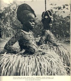 an old photo of two women in native garb