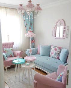 a living room filled with pink and blue furniture