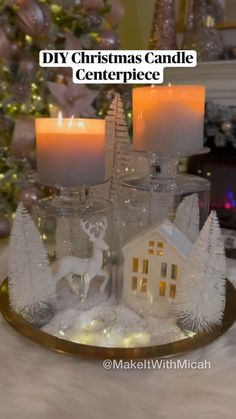 a christmas candle centerpiece with candles on it and a small house in the middle