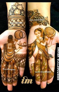 two hands with henna designs on them