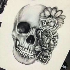 a drawing of a skull with flowers on it