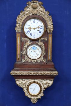 an ornate wooden clock with roman numerals on the face and sides against a blue background