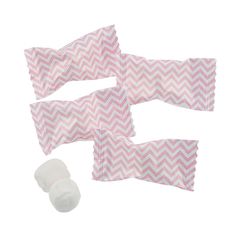 four pieces of pink and white chevroned paper