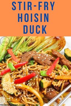 stir - fry hoisin duck with vegetables and sesame seeds on a white plate