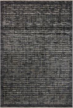 an area rug with black and white squares on the ground, in front of a gray background