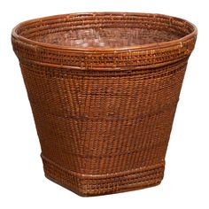 a brown wicker basket on a white background