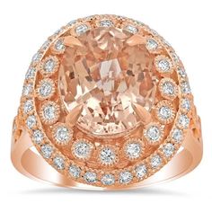 an oval cut peach diamond surrounded by white diamonds in a rose gold halo style ring