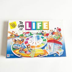 the game of life is displayed on a white surface