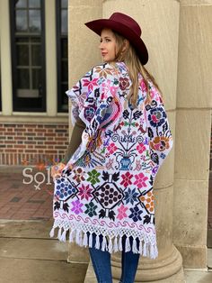 This Beautiful Hand Embroidered Poncho is perfect for keeping you warm and stylish at the same time. It has gorgeous hand embroidered details in both the front and back of the poncho. This poncho is handmade by Mexican Artisans and is completely one of a kind. Note: This poncho has open sides and comes in one size which is ideal for sizes, Small, Medium, Large, Extra Large, 2x, 3x. Multicolor Long Folk Kimono, Multicolor Long Folk Style Kimono, Folk Style Multicolor Kimono For Festivals, Multicolor Embroidered Bohemian Poncho, Handmade Multicolor Festival Kimono, Handmade Artisan Poncho For Festivals, One Size Traditional Beach Shawl, Traditional One-size Beach Shawl, Traditional One Size Shawl Kimono