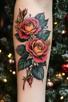 a woman's leg with roses and leaves on it