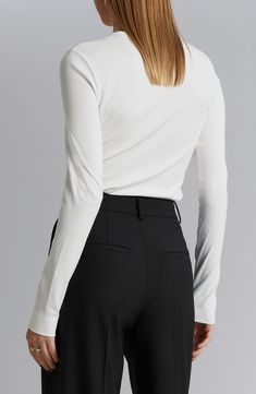 A touch of added stretch enhances the trim fit of a ribbed cotton T-shirt you'll wear from one season to the next. 21" length (size Small) Crewneck Long sleeves 95% cotton, 5% elastane Dry clean Imported White Tops With Ribbed Neckline For Work, White Fitted Top With Ribbed Neckline, Stretch Ribbed Tops For Work, White Ribbed Elastane Top, Fitted White Top With Ribbed Neckline, Fitted White Turtleneck Top, Ribbed Crew Neck Top For Work, Classic Tops For Workwear With Ribbed Neckline, White Turtleneck Tops For Work