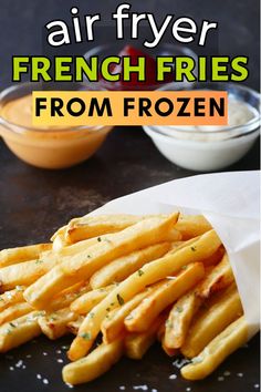 Cooked french fries wrapped in white parchment with sauces in the background and text "air fryer frozen fries". Frozen Fries In Air Fryer, Types Of French Fries, Air Fryer Frozen French Fries, Fries In Air Fryer, Fries In The Air Fryer, Air Fryer Fries, Frozen Fries, Make French Fries, Air Fryer French Fries