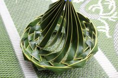 a bunch of green leaves sitting on top of a table