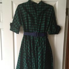 Belted Shirt Dress With A Green And Navy Plaid Print. Belt Is Navy. The Dress Features Functional Buttons Down The Front And Pockets! The Label Says Xl, But Fits More Like A Small/Medium. Waist Is Approximately 28 Inches And Bust Is About 32/34 Inches. Never Worn. Comes From A Cat Friendly House. Fitted Green Shirt Dress For Daywear, Fitted Plaid Cotton Shirt Dress, Plaid Short Sleeve Shirt Dress For Daywear, Cat Friendly House, Belted Shirt Dress, Retro Shirts, Cat Friendly, Plaid Print, The Label