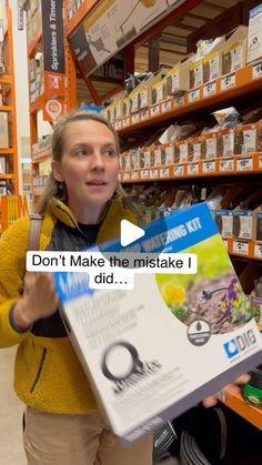 a woman holding up a box with the words don't make the mistake i did