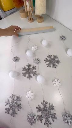 snowflakes are being made on the table