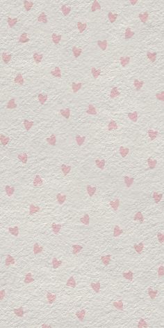 pink hearts on white paper with watercolor effect in the middle and light pink dots at the bottom