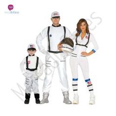 a man, woman and child dressed in astronaut costumes