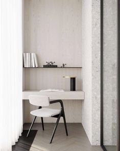 a white chair sitting in front of a desk next to a mirror and book shelf