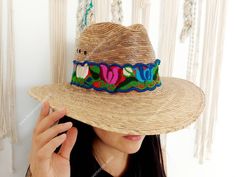 I love Mexico celebrates the native crafts of Mexico and the artists that produce them, enabling them and their communities to get recognized for their talented work and achieve economic stability for their families. This listing is for one piece of this beautiful handmade multi colored hat bands. They are prefect to add to your closet for your favorite dress, hat or even a shoulder bag as a lovely strap in multi colors. When purchasing please select the style you like referring to the picture w Artisan Handwoven Fedora, Adjustable Artisan Sun Hat For Spring, Handmade Adjustable Panama Hat For Spring, Handmade Curved Brim Hat Band For Country Events, Artisan Handwoven Adjustable Fedora, Handmade Multicolor Hats For Rodeo, Handmade Southwestern Multicolor Hats, Handmade Multicolor Southwestern Hats, Artisan Hat Bands For Summer Festivals