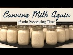 there are many mason jars lined up in front of a sign that says canning milk again