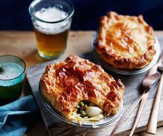 two pies sitting on top of a wooden table