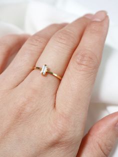 "NOTE: this listing is for IMPERFECT rings that I made in a hurry and discounted - please see photos against the black background for the EXACT ring you will receive along with noted flaws. If you would like one that is NOT flawed, they are available here: https://www.etsy.com/listing/777073152/ The tiniest whisper of sparkle for the modern minimalist - a tiny Swarovski crystal baguette hand set into a simple frame. The perfect neutral ring to wear alone or stacked. Stacks beautifully with other Gold Baguette Ring, Starfish Ring, Ring Minimal, Simple Frame, Baguette Ring, Jewelry Card, In A Hurry, Stacking Ring, Ring Gold