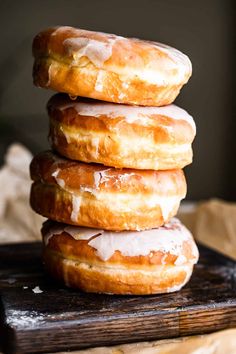 three glazed donuts stacked on top of each other