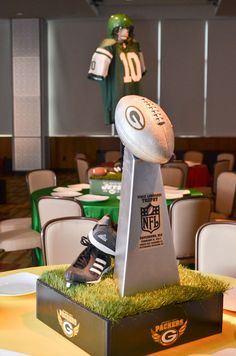 an image of a fake football on top of a table in a room with tables and chairs