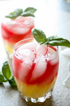 two glasses filled with watermelon, cucumber and mint garnish