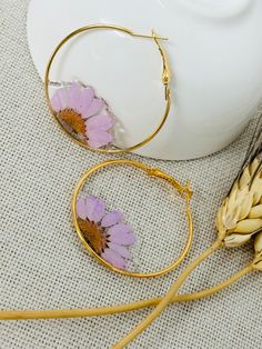 Hoop wires earring we real flower and resin. Cheap Resin Hoop Earrings, Hoop Flower Charm Earrings As Gift, Hoop Earrings With Flower Charm As Gift, Gift Hoop Earrings With Flower Charm, Bohemian Flower Hoop Earrings, Bohemian Flower-shaped Hoop Earrings, Bohemian Flower Hoop Earrings With Ear Wire, Adjustable Hoop Flower Earrings As Gift, Adjustable Flower Hoop Earrings As Gift