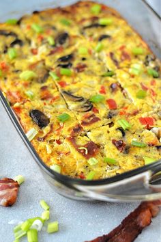 an egg casserole with bacon and green onions