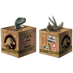 two cardboard boxes with dinosaurs in them on top of each other, one is holding a bird and the other has a dinosaur's head